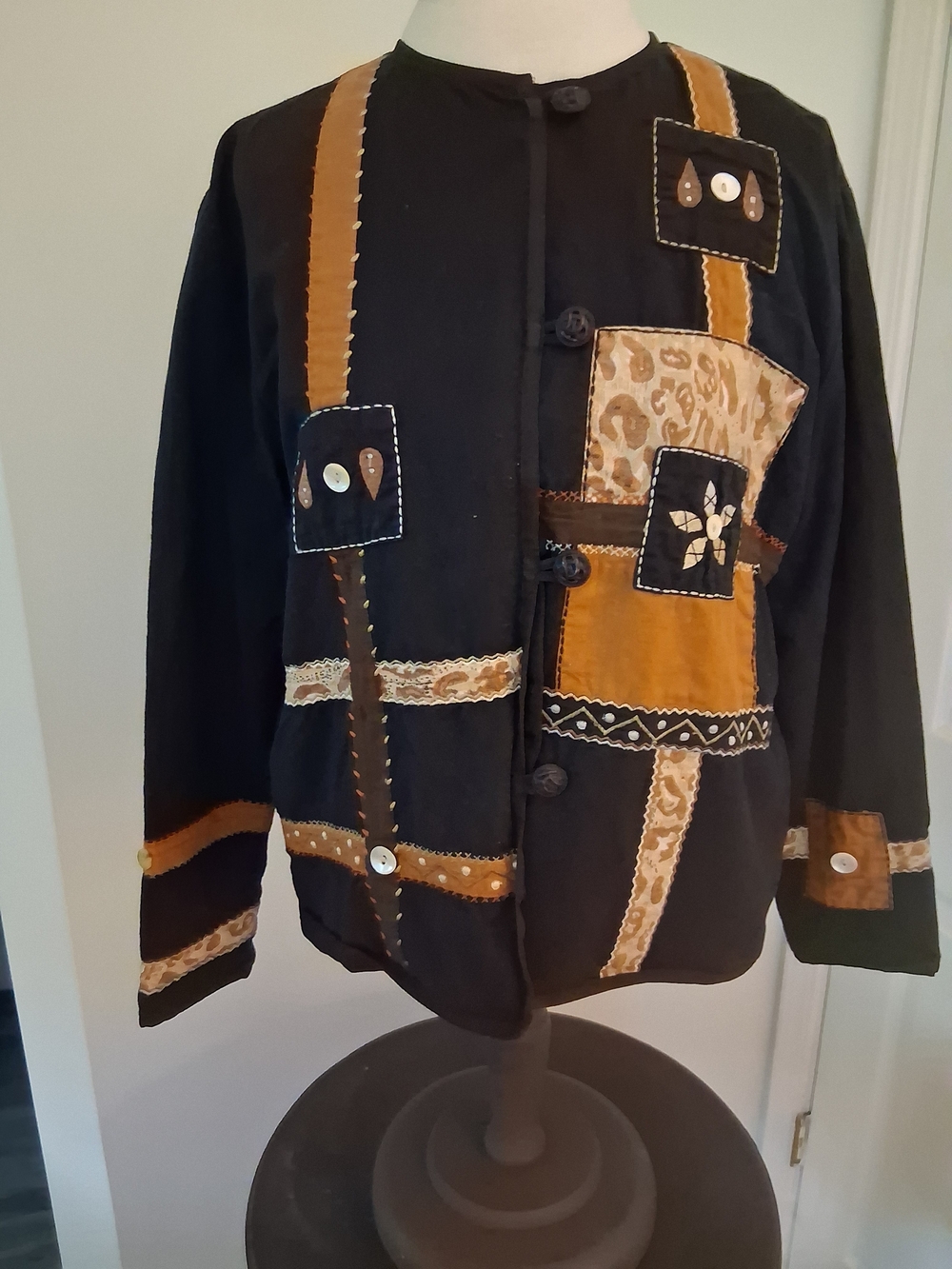 Allure Black Jacket With Button Accents.